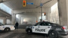 Fire crews are seen in the distance on Lakeshore Boulevard after a nearby group of tents beneath the Gardiner Expressway caught fire. (Michelle Dube/CTV NEWS TORONTO)