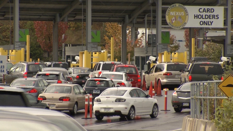 FILE: Drivers are seen lined up at a B.C. border crossing in March 2020. 