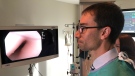 Dr. Paul Belletrutti, a gastroenterologist at the Peter Lougheed Centre, examines the footage from an endoscope