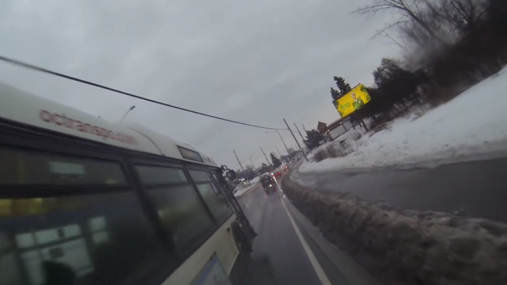 bus passes cyclist