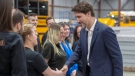 Prime Minister Justin Trudeau greets employees while touring the Lion Electric bus factory, Wednesday, March 4, 2020 in St-Jerome, Que.THE CANADIAN PRESS/Ryan Remiorz