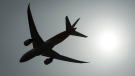 A plane is silhouetted as it takes off from Vancouver International Airport in Richmond, B.C., on May 13, 2019. THE CANADIAN PRESS/Jonathan Hayward
