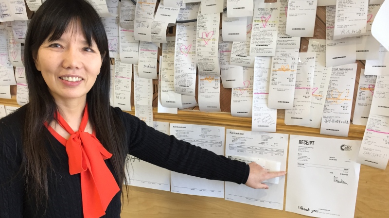 Joanna Jiang, owner of United Supermarket in London, Ont., points to a receipt for a $10,000 donation to the Canadian Society for Virology for COVID-19 research, Thursday, March 5, 2020. (Bryan Bicknell / CTV London)