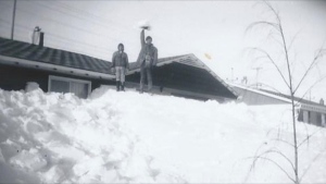 Manitobans dig their way out after one of the biggest snowstorms in history hits the province on March 4, 1966. Photo by Candice Masters.