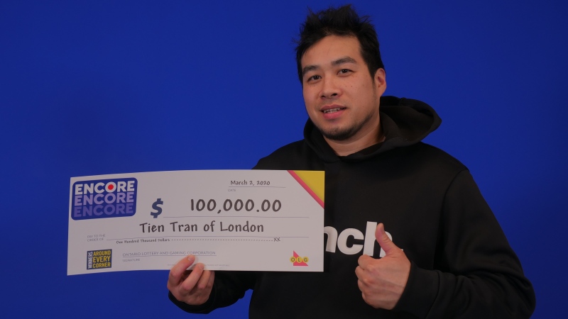 Tien Tran picks up his lotto winnings in Toronto. (Source: OLG)