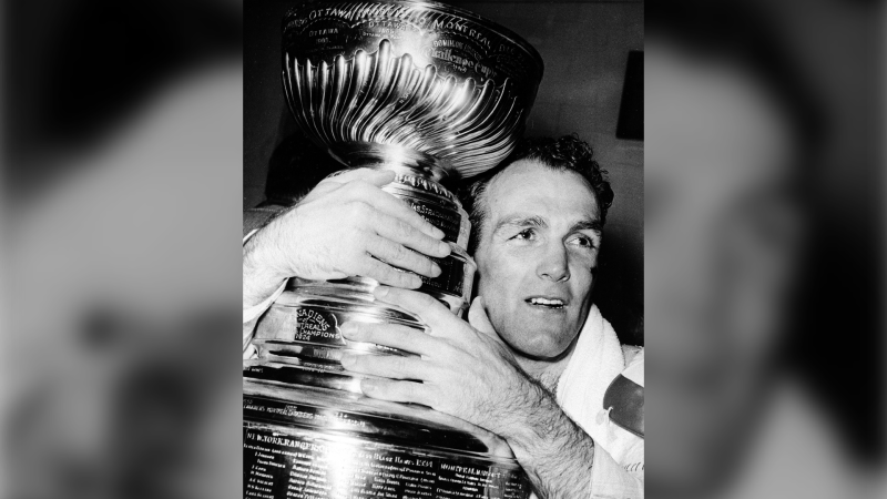 Montreal Canadiens forward Henri (Pocket Rocket) Richard hugs the Stanley Cup awarded to the National Hockey League champions in Detroit, Mich., Thursday night, May 5, 1966. THE CANADIAN PRESS/AP 
