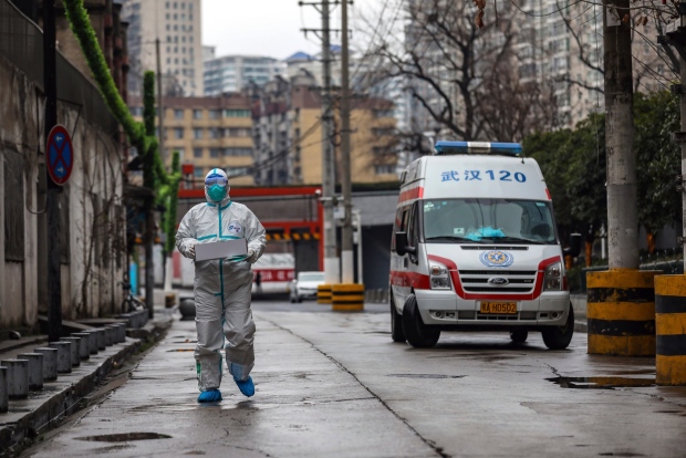 Ambulance worker carrying supplies in Wuhan, China