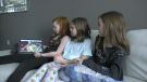 Selena, Kiera, and Kyla, all 9 years old playing LumaOne's interactive video on handwashing, March 6, 2020. (Peter Szperling / CTV News Ottawa) 