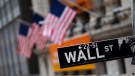 This Jan. 31, 2020, file photo shows a Wall Street sign in front of the New York Stock Exchange. (AP Photo/Mark Lennihan, File)