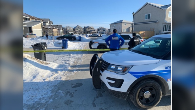 Police officers hold the scene in the 100 block of Kowalsky Crescent Tuesday morning near the home where police responding to a domestic disturbance fatally shot a 27 year-old man (Image: Jamie Dowsett-CTV News Winnipeg)
