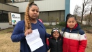 Bre-Anna Bonse and her children outside the Windsor-Essex County Health Unit in Windsor, Ont., on Wednesday, March 11, 2020. 