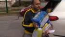 Vancouver resident Manny Ranga unloads cleaning supplies from his car on Friday, March 13, 2020. (CTV)