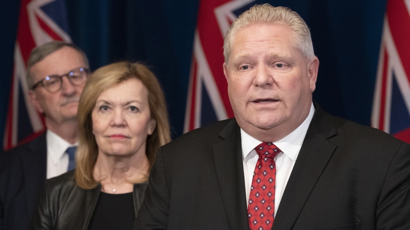 Ontario Premier Doug Ford answers questions as Minister of Health Christine Elliott and Ontario Chief Medical Officer of Health Dr. David Williams, left, listen in during a news conference at the Ontario Legislature in Toronto on Monday March 16, 2020. THE CANADIAN PRESS/Frank Gunn