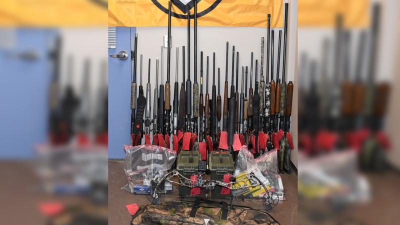 Police say they seized 27 firearms, $45,000 in cash and a stolen Dodge Ram pickup truck. (Source: Brantford Police Service)