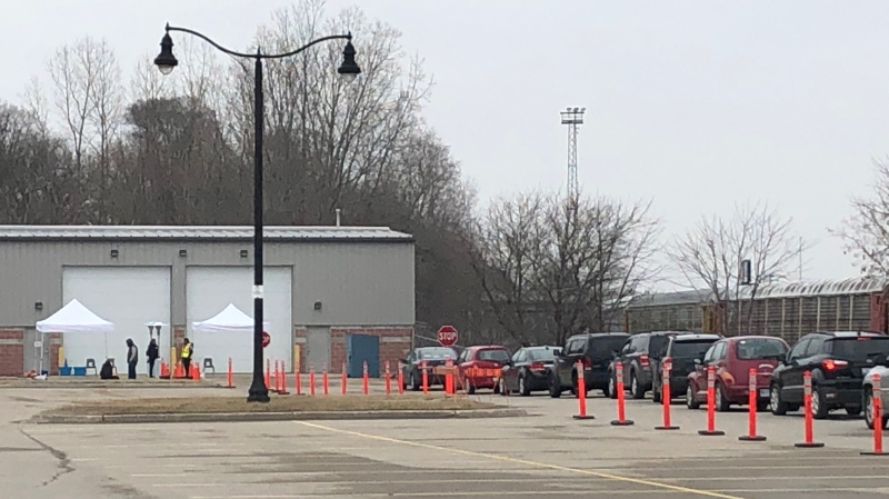 Dozens of cars were lined up as a second COVID-19 Assessment Centre opened in London, Ont. on Thursday, March 19, 2020. (Jim Knight / CTV London)