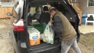 A volunteer with the South Asian Association of London and Surrounding Area delivers groceries in London, Ont. on Friday, March 20, 2020. (Jim Knight / CTV London)