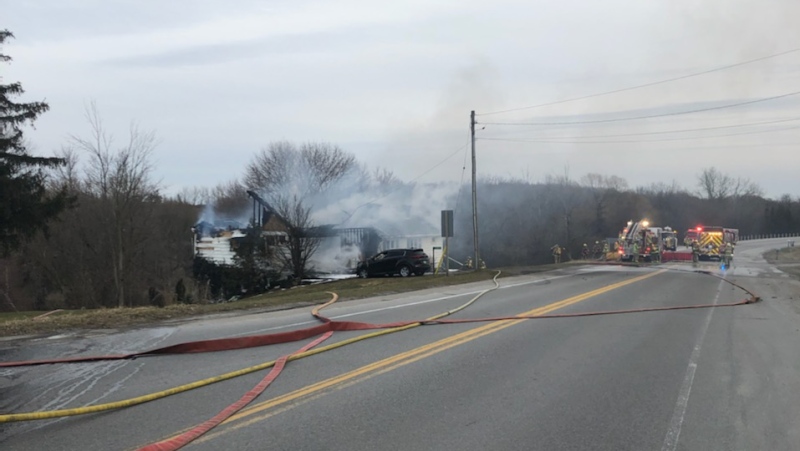 Crews work at the scene of fire on Perth Road 164 near Mitchell, Ont. on Sunday, March 22, 2020. (Source: Perth County OPP)
