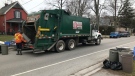 A City of London sanitation worker collects in London, Ont.'s Old South neighbourhood  on Friday, March 27, 2020. (Sean Irvine / CTV London)