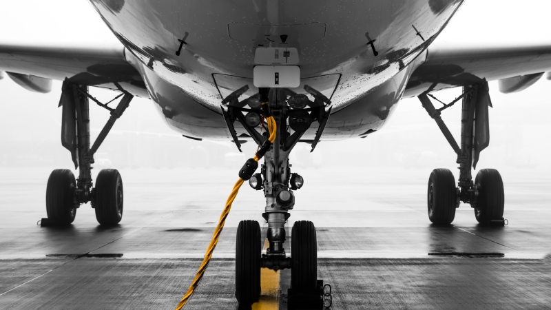The bottom of an airplane is seen in this stock photo. (Joel Super/Pexels)