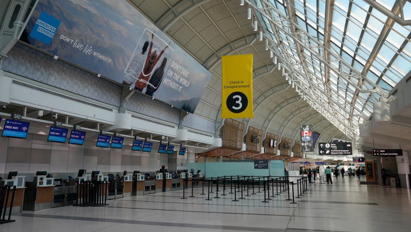 An almost-empty Terminal 3 is shown at Pearson International Airport in Toronto, Friday, March 13, 2020. Provincial governments have advised against international travel and Ontario announced plans to close its schools for two weeks because of COVID-19.THE CANADIAN PRESS/Frank Gunn