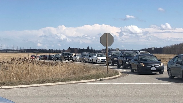 Large lines at the Oneida of the Thames First Nation, as customers line up for cigarettes and gas prior to a shutdown over COVID-19 concerns on March 29, 2020. (Jordyn Read/CTV London)