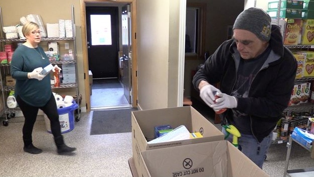 Volunteers at the North Huron Community Food Share pack hampers in Wingham Ont. on March 30, 2020.(Scott Miller/CTV London)