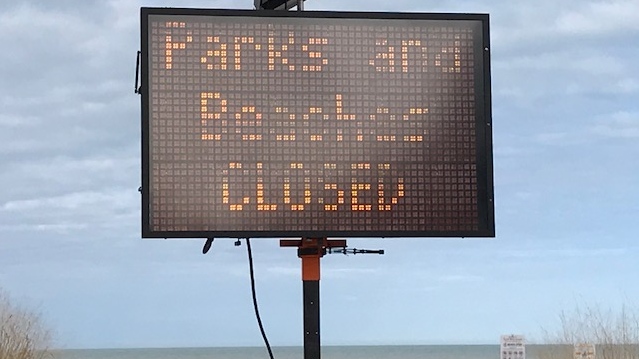 A sign at the main beach in Grand Bend, Ont. shows the are is closed on Wednesday, April 1, 2020. (Sean Irvine / CTV London)