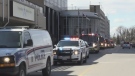 Police cruisers, ambulances and fire trucks made their way by hospitals in London, Ont. on Wednesday, April 1, 2020 in a salute to health care workers. (Jim Knight / CTV London)
