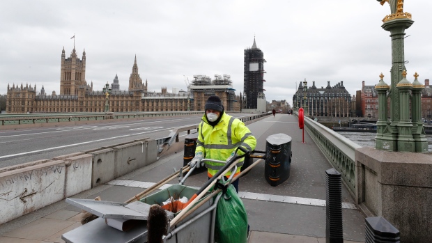 A street cleaner wearing a mask in London, U.K.