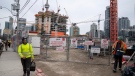 Construction workers at a site shift change in Toronto on Wednesday March 18, 2020. THE CANADIAN PRESS/Frank Gunn