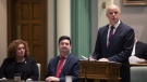 Sherry Gambin-Walsh, minister of service, left to right, and Christopher Mitchelmore, minister of tourism, culture and innovation listen as Finance Minister Tom Osborne presents the 2019 Budget in the House of Assembly in St. John's on April 16, 2019. (THE CANADIAN PRESS/Paul Daly)