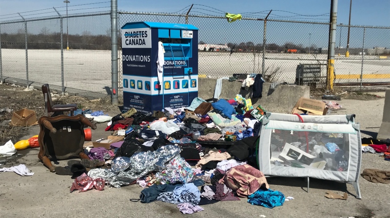 Diabetes Canada clothing donation bin overflows in Windsor, Ont., on Monday, April 6, 2020. (Michelle Maluske / CTV Windsor)