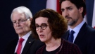 Deputy Minister of Foreign Affairs Marta Morgan speaks as Minister of Transport Marc Garneau, left, and Prime Minister Justin Trudeau, right, look on as they hold a press conference at the National Press Theatre in Ottawa on Wednesday, Jan. 8, 2020. THE CANADIAN PRESS/Sean Kilpatrick