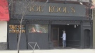 Crews board up Joe Kool's in downtown London, Ont. on Wednesday, April 8, 2020. (Jim Knight / CTV London)
