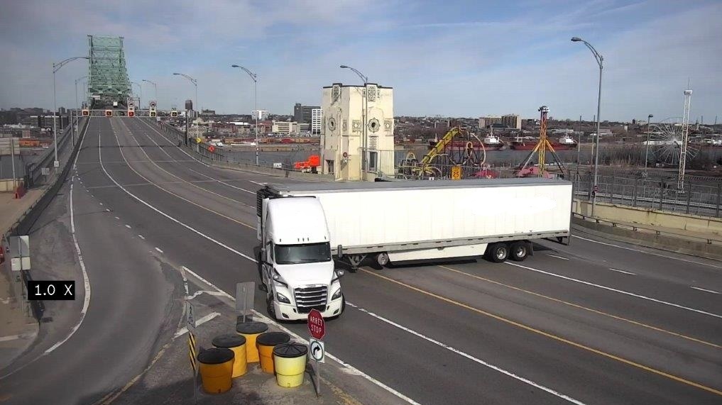 Truck performs ill-advised U-turn on bridge