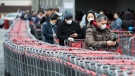 Hundreds of people wait in line to enter Costco in Toronto on Monday, April 13, 2020. Health officials and the government have asked that people stay inside to help curb the spread of COVID-19. THE CANADIAN PRESS/Nathan Denette
