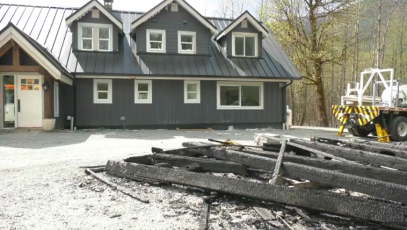 Alicia Myton and Todd Mumford's carport was destroyed by a wildfire, but their home was saved. (CTV)