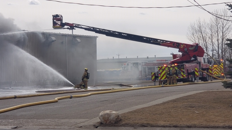 Crews work to contain a fire at Loraas Disosal Services.