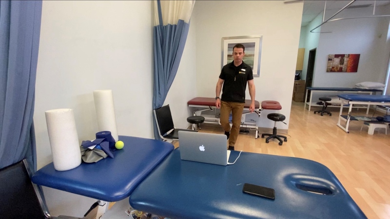 Physiotherapist Paul Colebrook guiding a patient through a virtual treatment at Pro Physio on Riverside Court. Ottawa, ON. April 16, 2020. (Tyler Fleming / CTV News Ottawa)