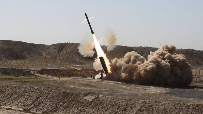 In this photo released by the Iranian semi-official Mehr News Agency, Revolutionary Guard's Zelzal missile is launched in a drill, Sunday Sept. 27, 2009, near the city of Qom, 130 km south of Tehran, Iran.