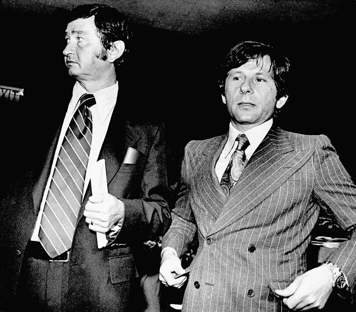 Roman Polanski and his attorney Douglas Dalton stand in courtroom in Santa Monica, Calif., Aug. 9, 1977. (AP Photo)