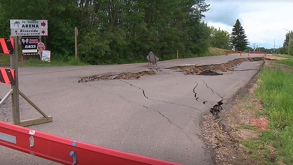 Road damaged by flooding in Lac Ste. Anne County