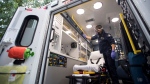 (File photo) B.C. Ambulance paramedic Jeff Booton cleans his ambulance at station 233 in Lions Bay, B.C. Wednesday, April 22, 2020. THE CANADIAN PRESS/Jonathan Hayward