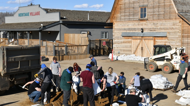 Sandbags prepared by volunteers await placement around historic buildings at the Heritage Village site in Fort McMurray, Alberta on Wednesday April 30, 2020. THE CANADIAN PRESS/Greg Halinda