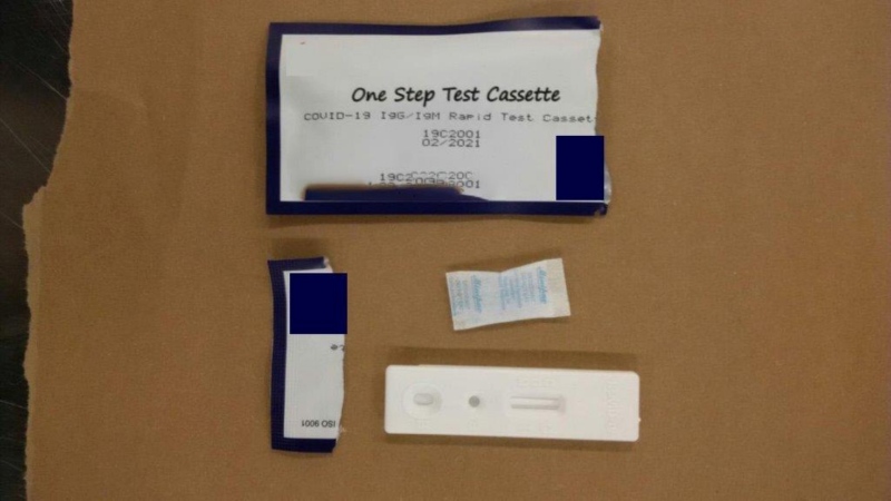 Mounties say they have seized 1,500 unauthorized COVID-19 test kits from a Richmond resident, who had acquired and sold them without approval from Health Canada. (BC RCMP handout)