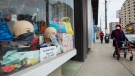 Mannequin heads are on display with face masks for sale in a storefront window during the COVID-19 pandemic in Toronto on April 29, 2020. (Nathan Denette / THE CANADIAN PRESS)