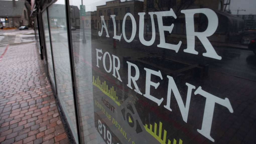 A for rent sign in a storefront window