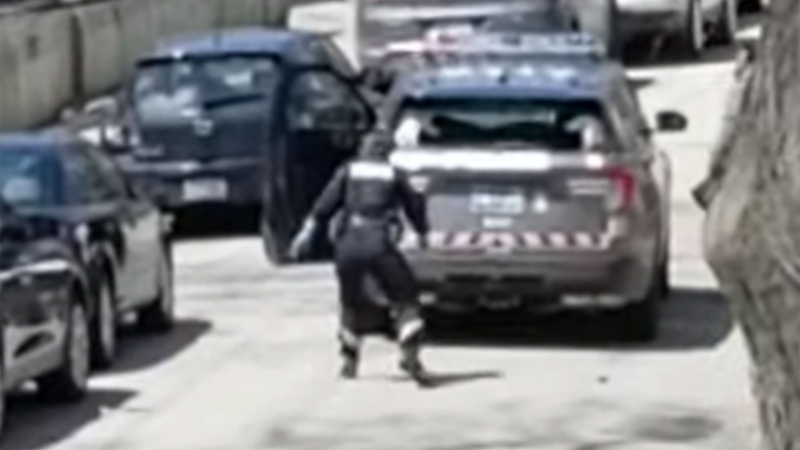 An officer dodges a man throwing rocks in an image froma  video posted to YouTube Monday May 4, 2020. (Erin Leslie /YouTube)