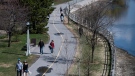 People walking along the Rideau Canal Western Pathway in the midst of the COVID-19 pandemic, in Ottawa on Sunday, May 3, 2020. THE CANADIAN PRESS/Justin Tang