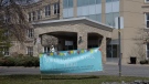  A sign thanks workers outside the Madonna Care Community facility in Orleans, Ont. Wednesday May 6, 2020. The facility has been significantly affected by Covid-19. (Adrian Wyld/THE CANADIAN PRESS) 